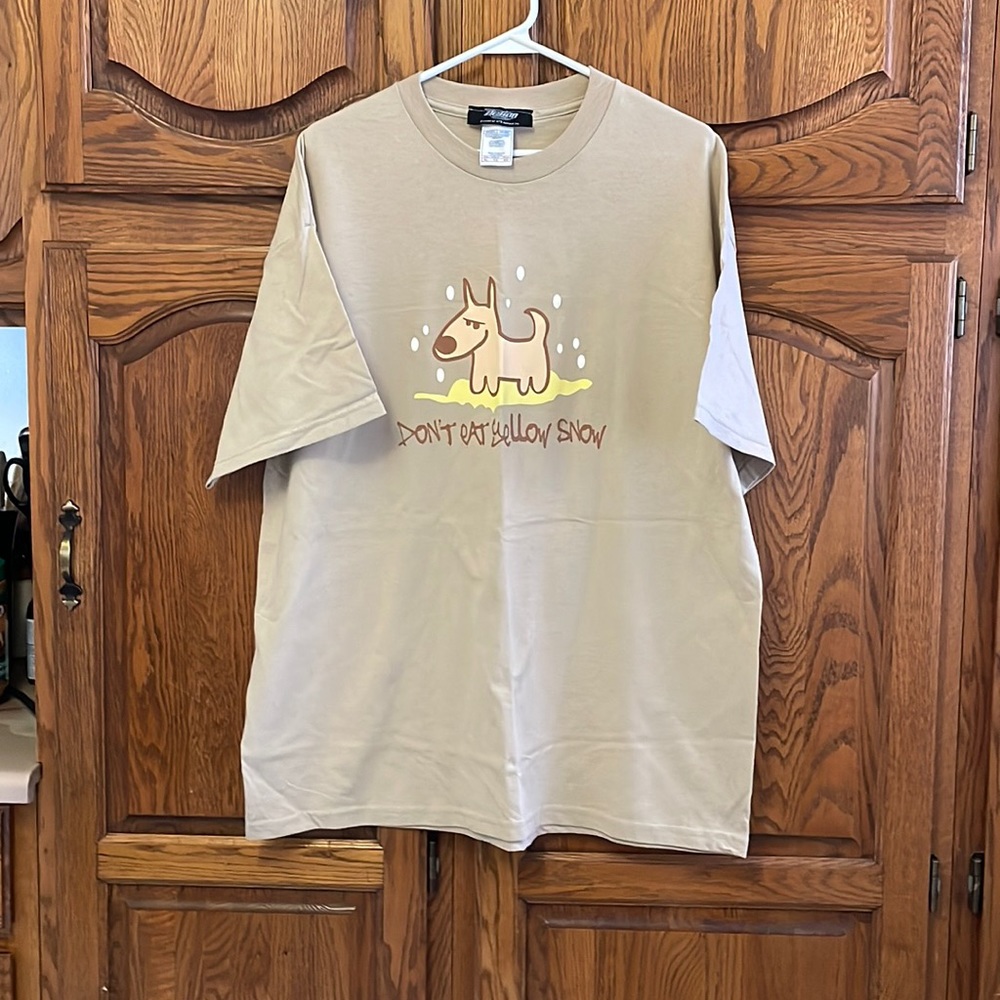 Men’s XL graphic tan coloured T-shirt.  Action brand.  100% cotton (pre shrunk)